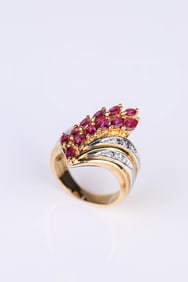AN 18K GOLD AND PLATINUM RUBY AND DIAMOND RING