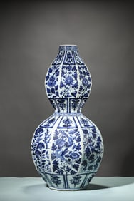 A BLUE AND WHITE 'EIGHT TREASURES AND FLOWERS' VASE