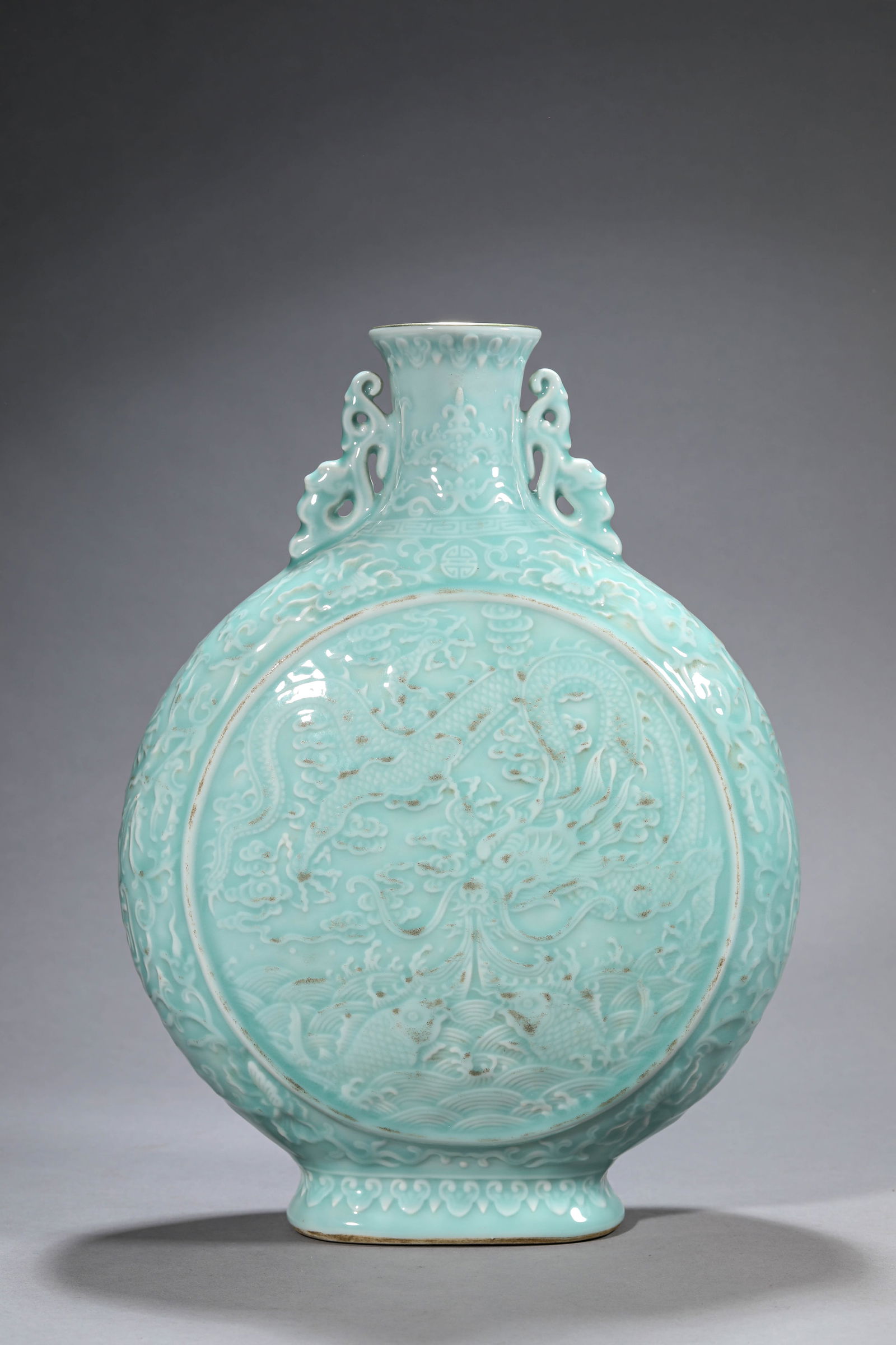 A CELADON GLAZED MOONFLASK: A CELADON GLAZED MOONFLASK Dimensions: Length: 27.5 cm (10.83 in) x Width: 13.5 cm (5.31 in) x Height: 36.6 cm (14.41 in). All measurements are approximate.