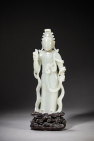 A JADE FIGURE OF BUDDHA