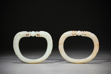 A PAIR OF JADE BANGLES