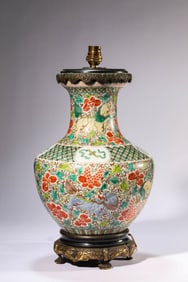 A WUCAI 'EIGHT TREASURES AND AUSPICIOUS BEASTS' VASE