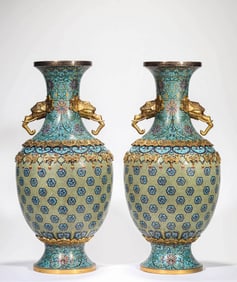 A CLOISONNé ENAMEL 'DRAGON' REVOLVING VASE WITH ELEPHANT HANDLES