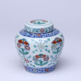 A WUCAI 'ROUNDEL FLOWERS AND BUTTERFLIES' COVERED JAR