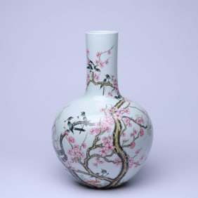 A FAMILLE ROSE 'PLUM BLOSSOM AND MAGPIE' GLOBULAR VASE