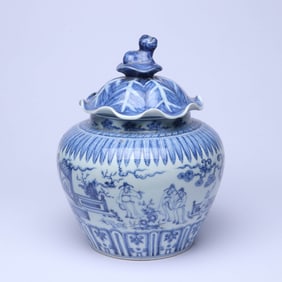 A BLUE AND WHITE 'FIGURES AND STORY' LOTUS-LEAF COVERED JAR
