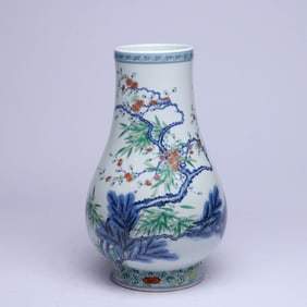 A DOUCAI 'PINE, BAMBOO, PRUNUS AND DEER' DEER-HEAD JAR