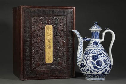 A BLUE AND WHITE 'FLOWERS AND FRUIT' EWER