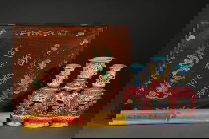 A RED-GROUND YANGCAI 'FLOWERS' TRIPLE REVOLVING VASE