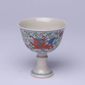 A WUCAI 'AUSPICIOUS BEASTS AMONG FLOWERS' STEM CUP