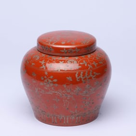 A RED-GROUND 'FIGURES AND STORY' JAR