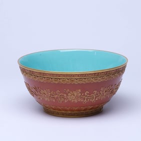 A CORAL RED-GROUND 'FLOWERS' BOWL