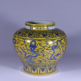 A YELLOW-GROUND BLUE AND WHITE 'CLOUD AND DRAGON' JAR
