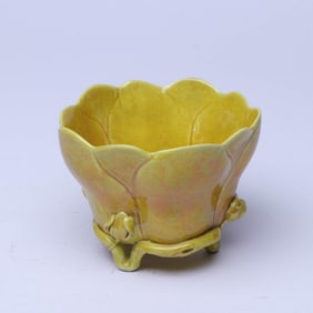 A YELLOW-GLAZED MAGNOLIA-FORM CUP