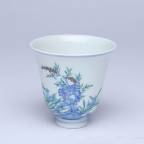 A DOUCAI 'ROCKERY AND FLOWERS' CUP