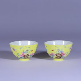 A PAIR OF YELLOW-GROUND FAMILLE ROSE 'FLORAL ' CUPS