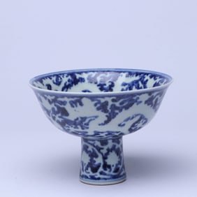 A BLUE AND WHITE 'WAVES, CLOUD AND DRAGON, RESERVE' STEM BOWL