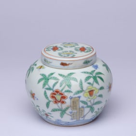 A WUCAI 'FLOWERS AND BUTTERFLIES' COVERED JAR