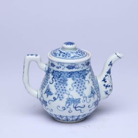 A BLUE AND WHITE 'GRAPES AND BUTTERFLIES' EWER