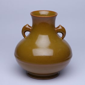 A TEA-DUST GLAZED ELEPHANT-HANDLE JAR