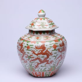 A RED AND GREEN 'WAVES, CLOUD AND DRAGON' HEXAGONAL COVERED JAR