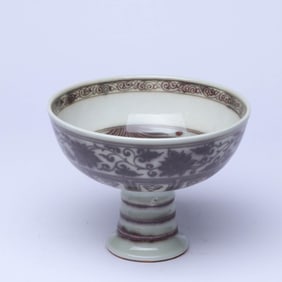 A UNDERGLAZED RED 'INTERLOCKING FLOWERS AND FISH' STEM BOWL