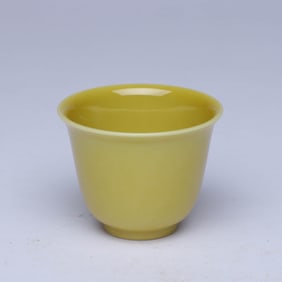 A YELLOW-GLAZED CUP