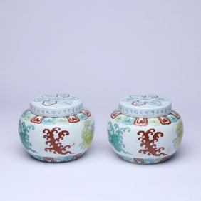 A PAIR OF WUCAI 'SCROLLING FOLIAGE' COVERED JARS