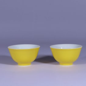 A PAIR OF YELLOW-GLAZED CUPS