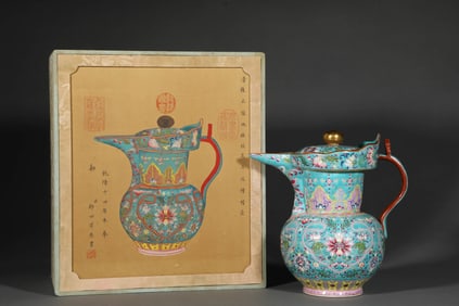 A GREEN-GROUND FAMILLE ROSE 'FLORAL' MONK'S-CAP EWER