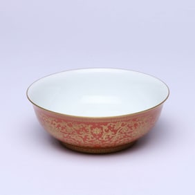 A CORAL RED-GROUND 'INTERLOCKING FLOWERS' BOWL
