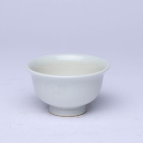 A WHITE-GLAZED CUP
