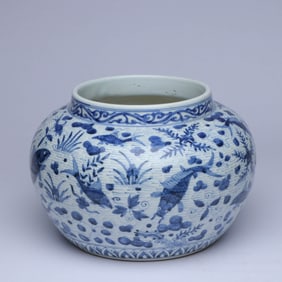 A BLUE AND WHITE 'FISH AND WATER WEEDS' JAR