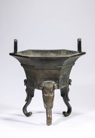 A BRONZE 'ELEPHANT-TRUNK LEGS' TRIPOD CENSER