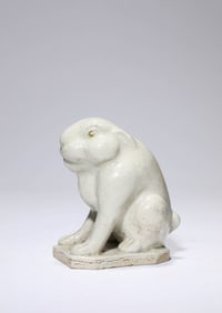 A WHITE PORCELAIN RABBIT