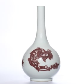 A UNDERGLAZED RED 'THREE LIONS' VASE