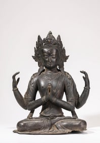 AN ALLOY BRONZE FIGURE OF FOUR-ARMED AVALOKITESHVARA