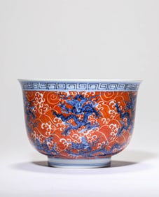 A BLUE AND WHITE AND IRON-RED 'DRAGON AMIDST WAVES' BOWL