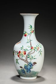 A FAMILLE-ROSE 'AUSPICIOUS BEAST AMIDST WAVES' VASE