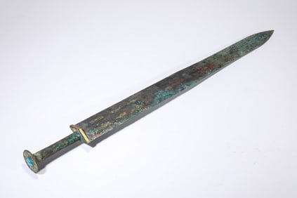 A GOLD-INLAID BRONZE SWORD