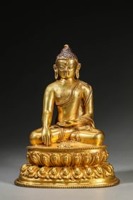 A GILT-BRONZE FIGURE OF SHAKYAMUNI