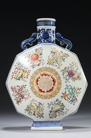 A BLUE AND WHITE AND FAMILLE-ROSE 'EIGHT BUDDHIST EMBLEMS AND FIVE BATS AROUND A SHOU' MOONFLASK