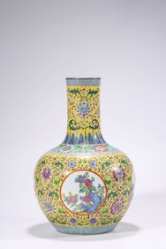 A YELLOW-GROUND FAMILLE-ROSE 'FLORAL RESERVES' CELESTIAL GLOBE VASE