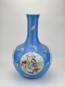 A BLUE-GROUND 'FAMILLE-ROSE FIGURAL RESERVES' VASE