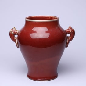 A RED-GLAZED DOUBLE-HANDLE JAR