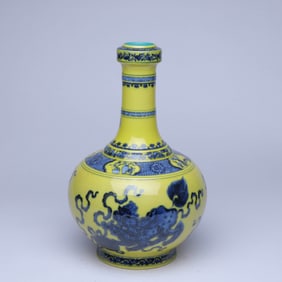 A YELLOW-GROUND BLUE AND WHITE 'LION AND BALL' VASE