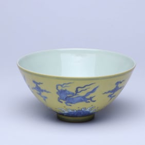 A YELLOW-GROUND BLUE AND WHITE 'FLYING HORSE' BOWL