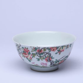 AN ENAMEL 'ROCKERY, FLOWERS, BIRDS AND POMEGRANATE' BOWL