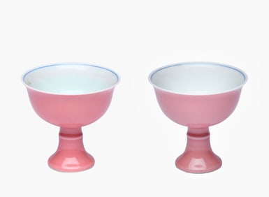 A PAIR OF PINK-GROUND BLUE AND WHITE 'LION' STEM CUPS
