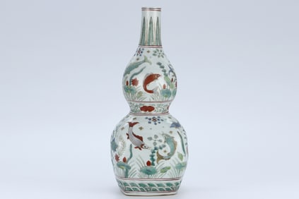 A SANCAI 'FISH AND WATER WEEDS' GOURD-SHAPED VASE